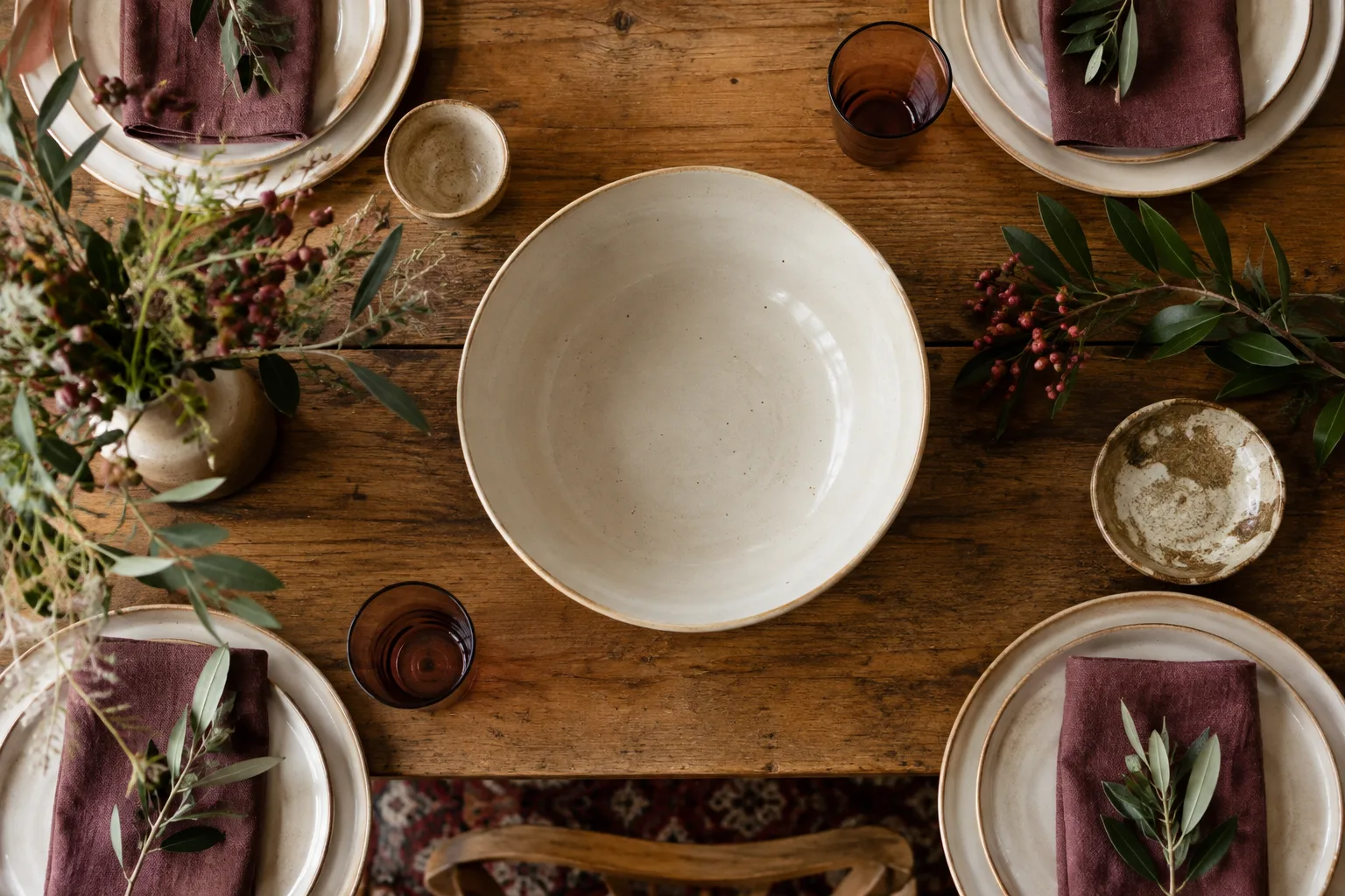 A low ceramic serving bowl among everyday plates